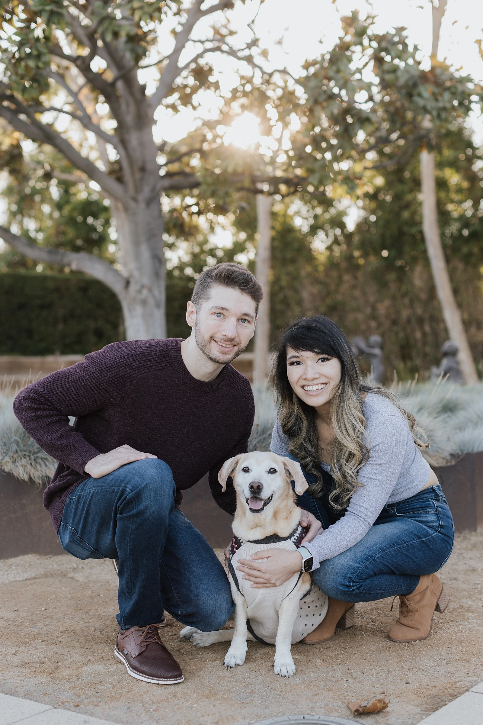Dr. Gloria Luong outdoors with her family and their dog