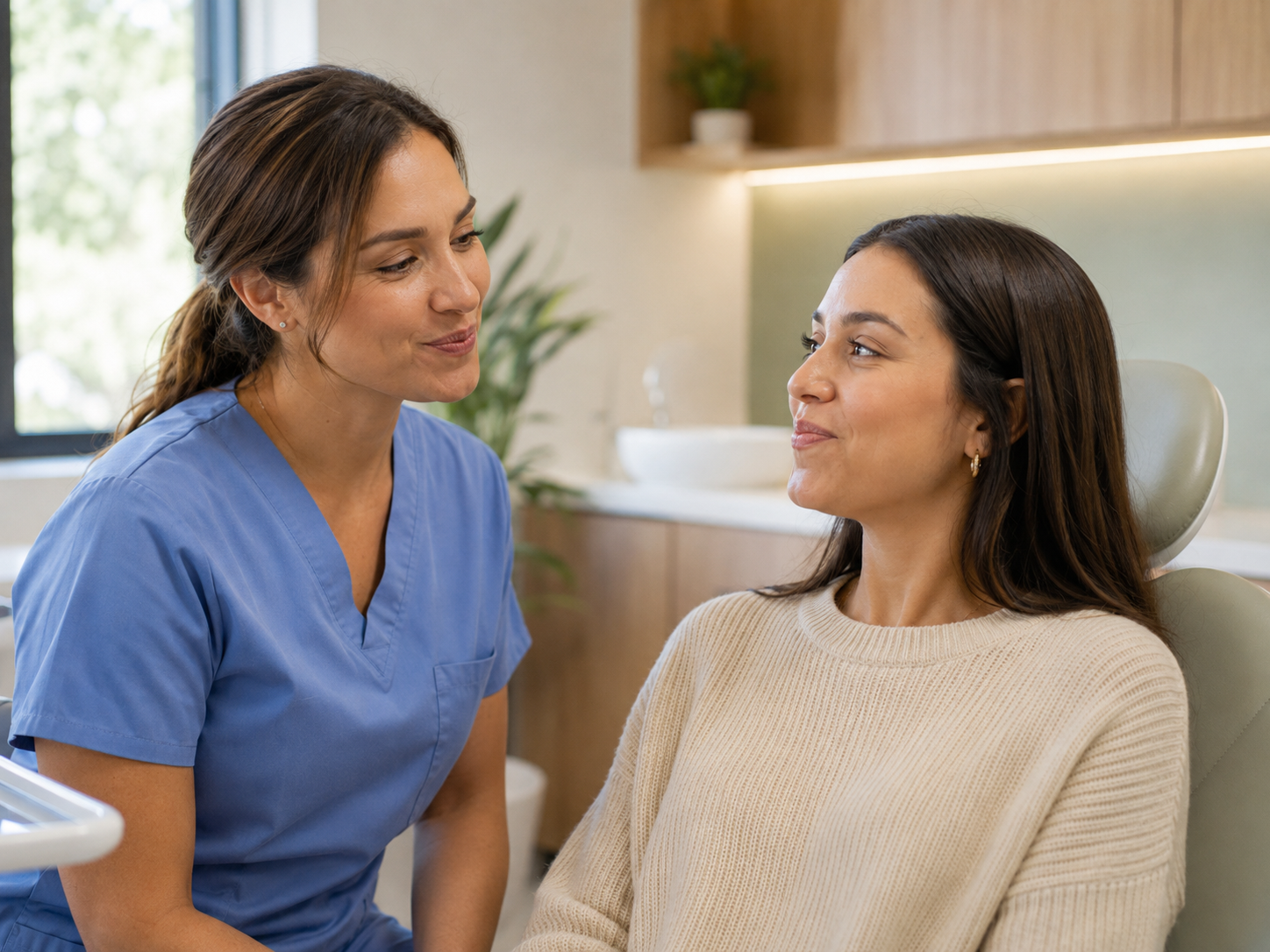 A dental hygienist guiding a patient through a myofunctional therapy session at South Bay Dental Loft