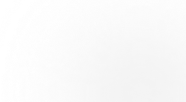 Blurred grayscale image with indistinct patterns and no clear subject.