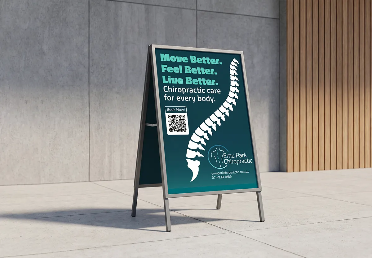 Outdoor sign with spine graphic and text promoting Emu Park Chiropractic and booking via QR code.