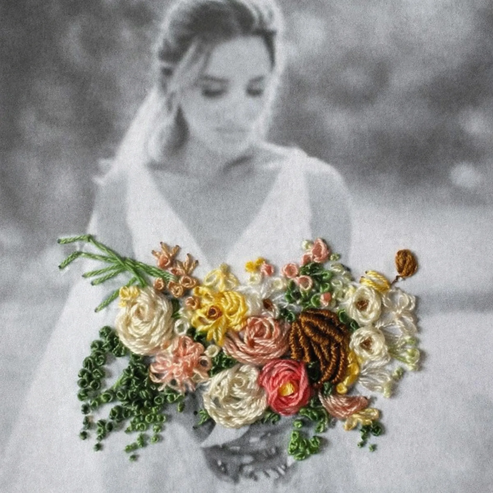 Documentary wedding photographer black and white bridal portrait with hand-embroidered flower bouquet