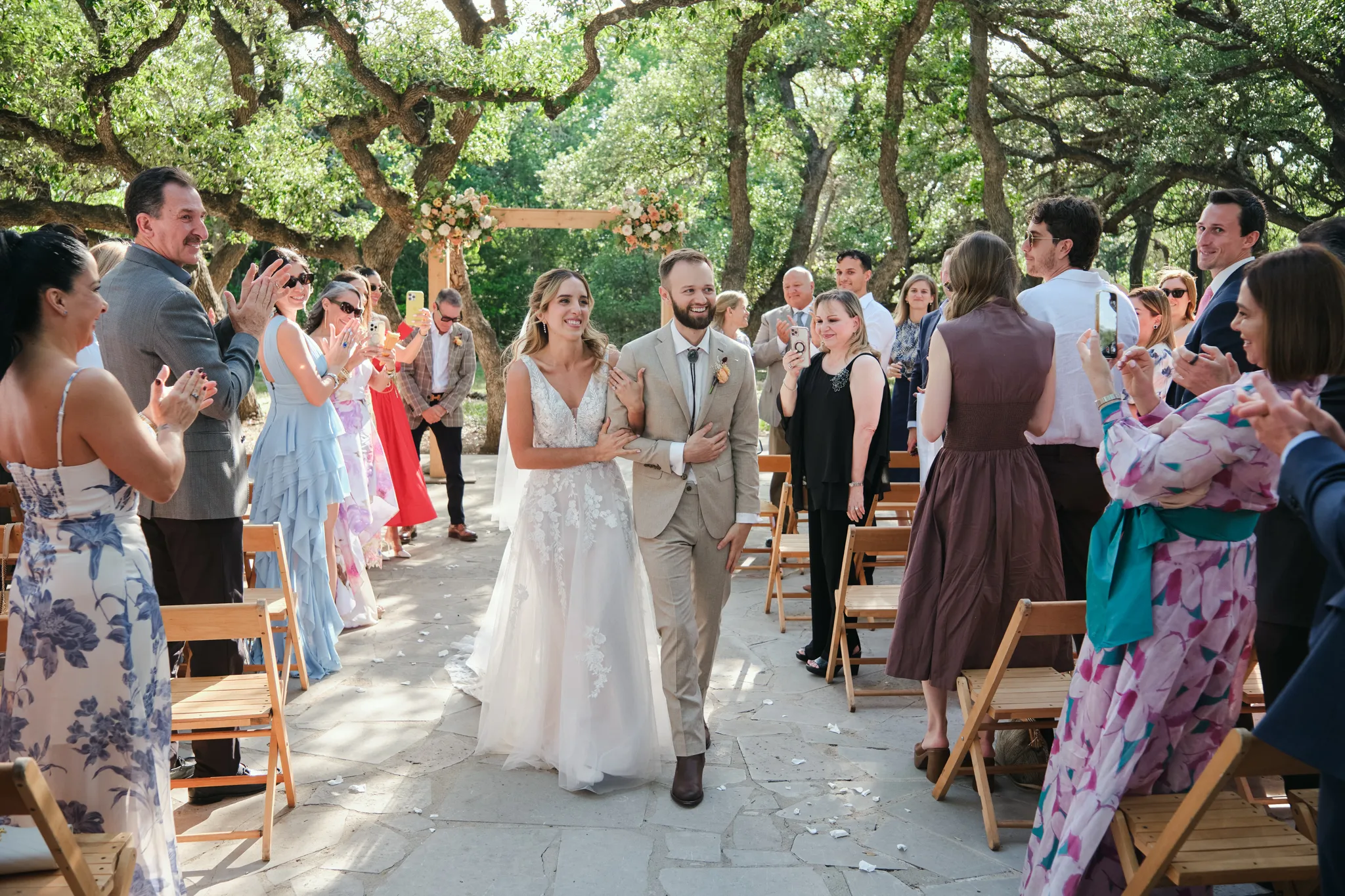 Documentary wedding photographer bride and groom recessional at outdoor garden ceremony
