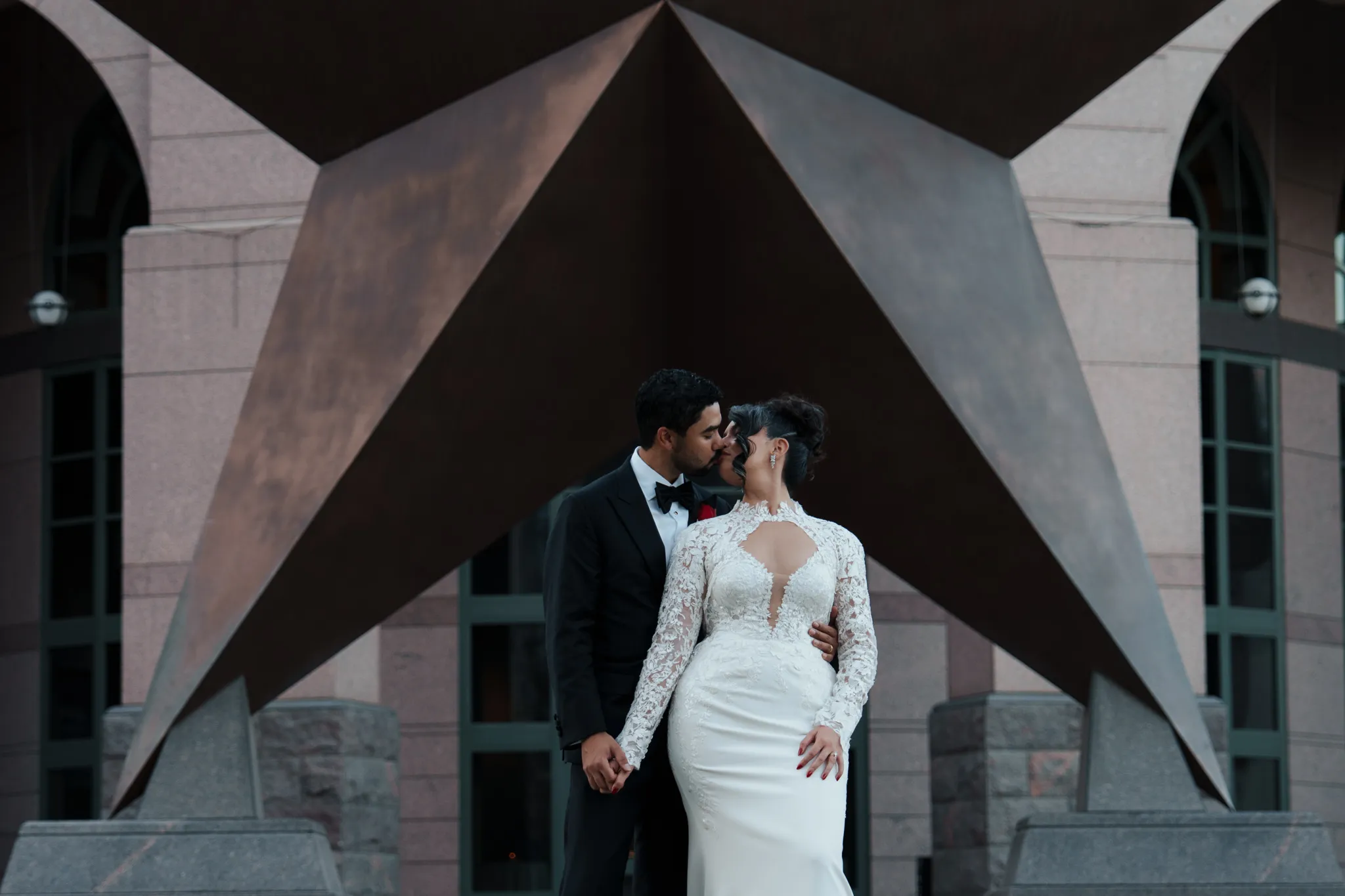Bride and groom sharing a quiet embrace during their Austin Texas wedding, captured by documentary wedding photographer Moments By Marcela