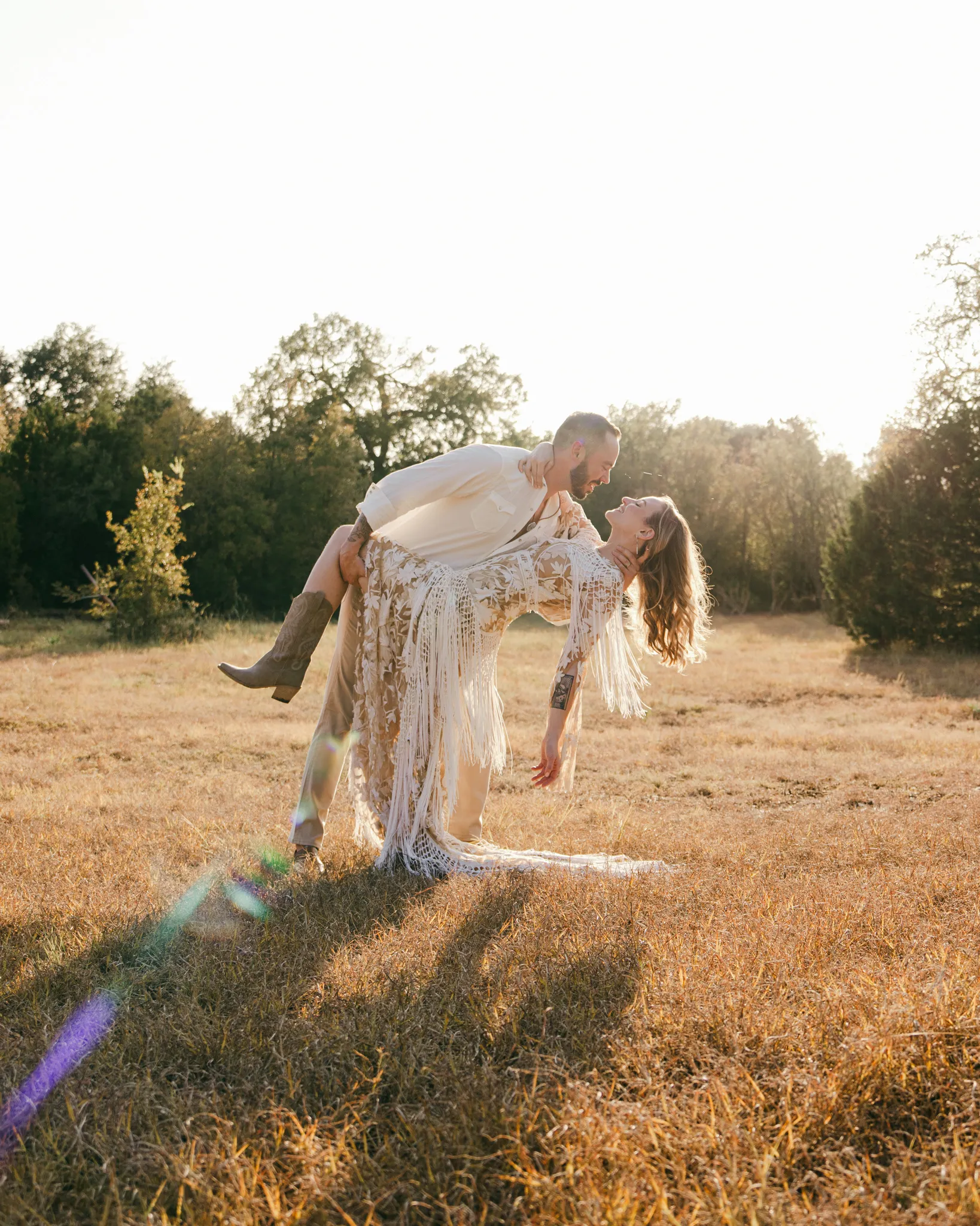 Austin Texas wedding photographer bride and groom running hand in hand through a lush mountain meadow