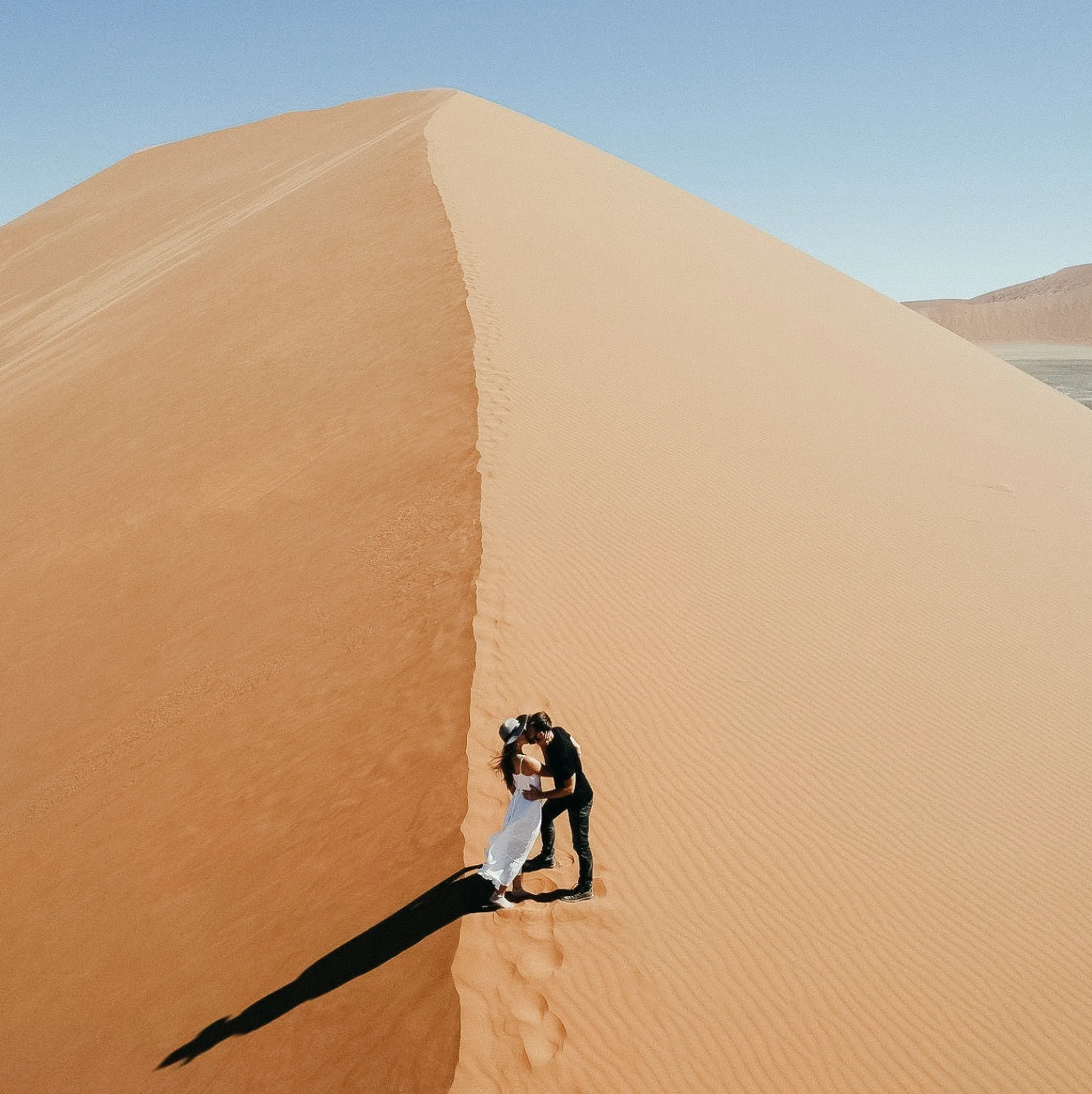 Austin Texas wedding photographer joyful outdoor ceremony with two brides one wearing a purple sari