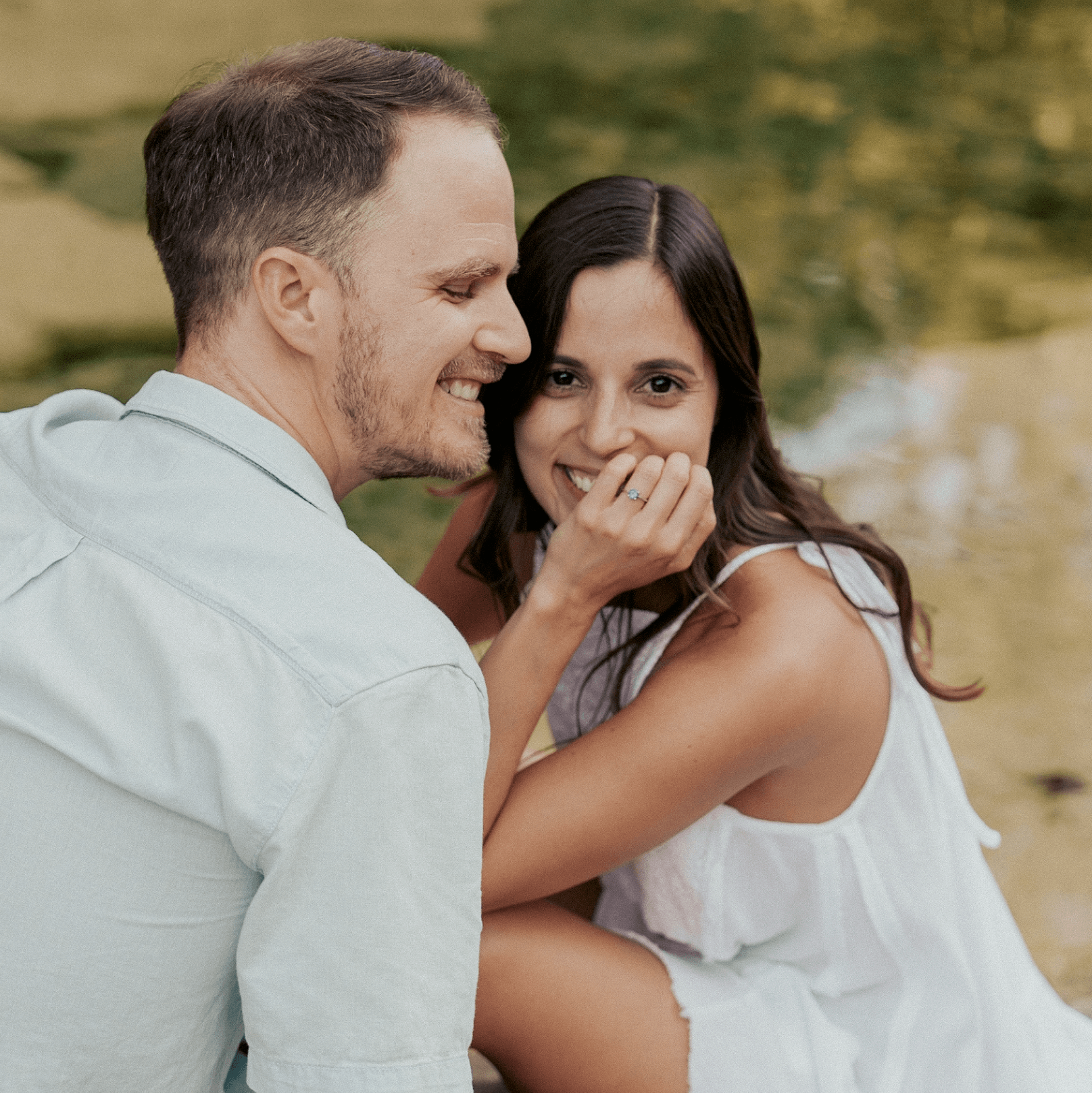 Austin Texas wedding photographer candid moment of two brides laughing under string lights at night one wearing a pink sari