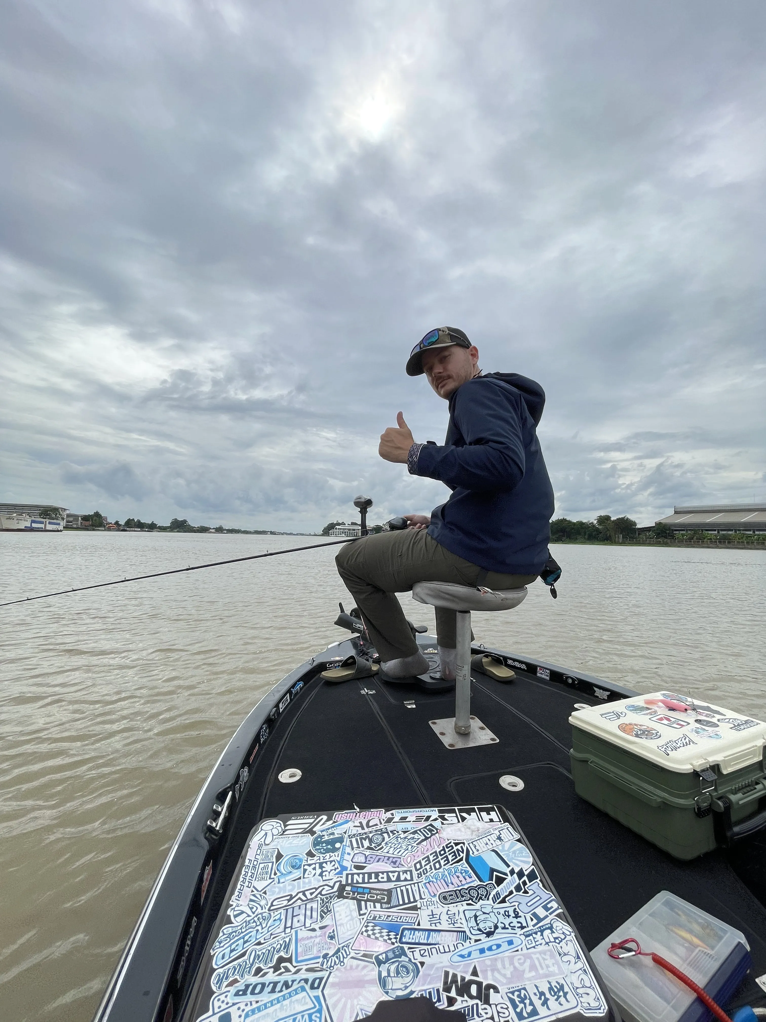 Anchored and fishing for shrimp from a small boat on the Chao Phraya river