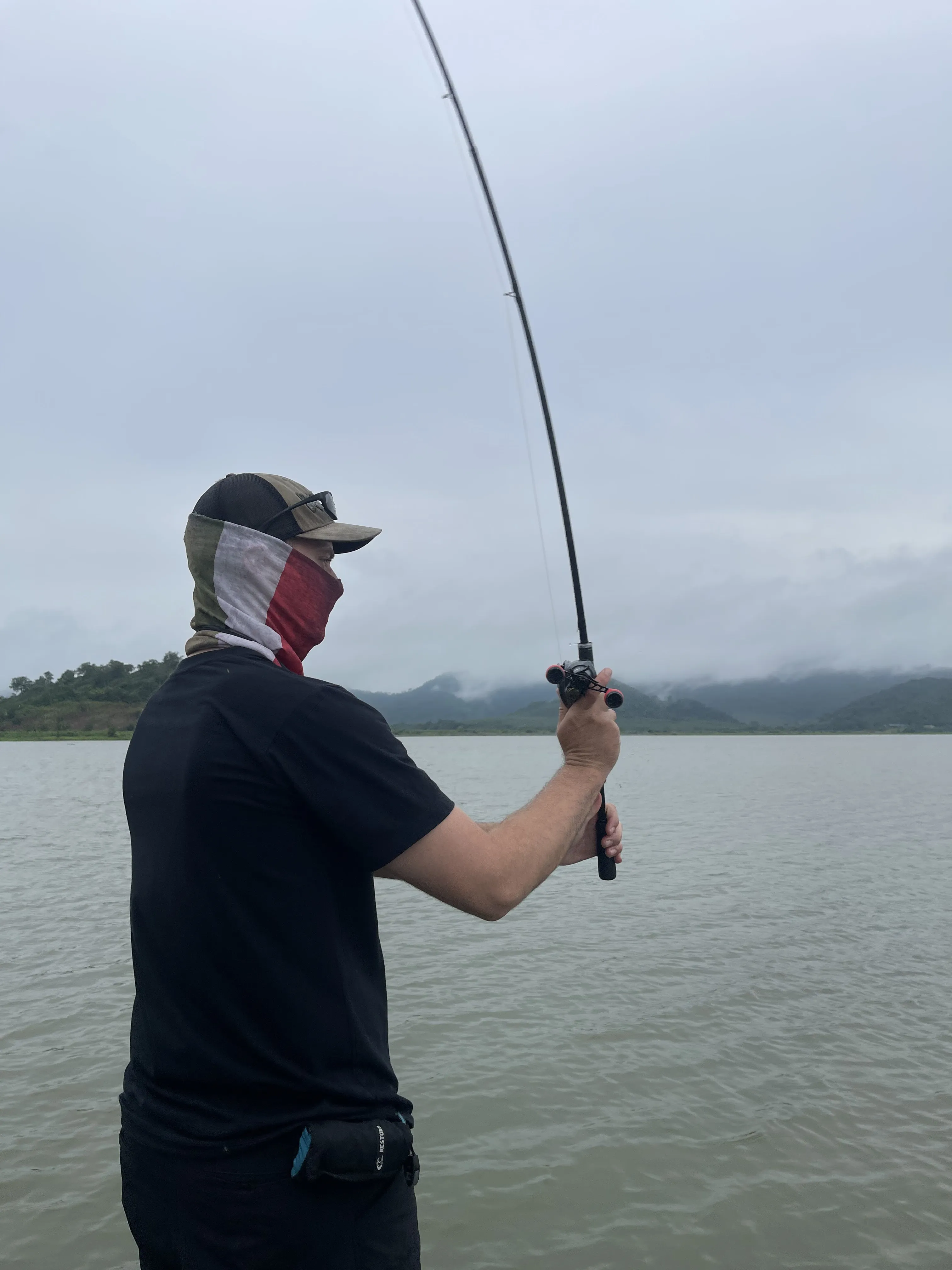 A beautiful snakehead caught by skipping casts under trees at Hang Maeo