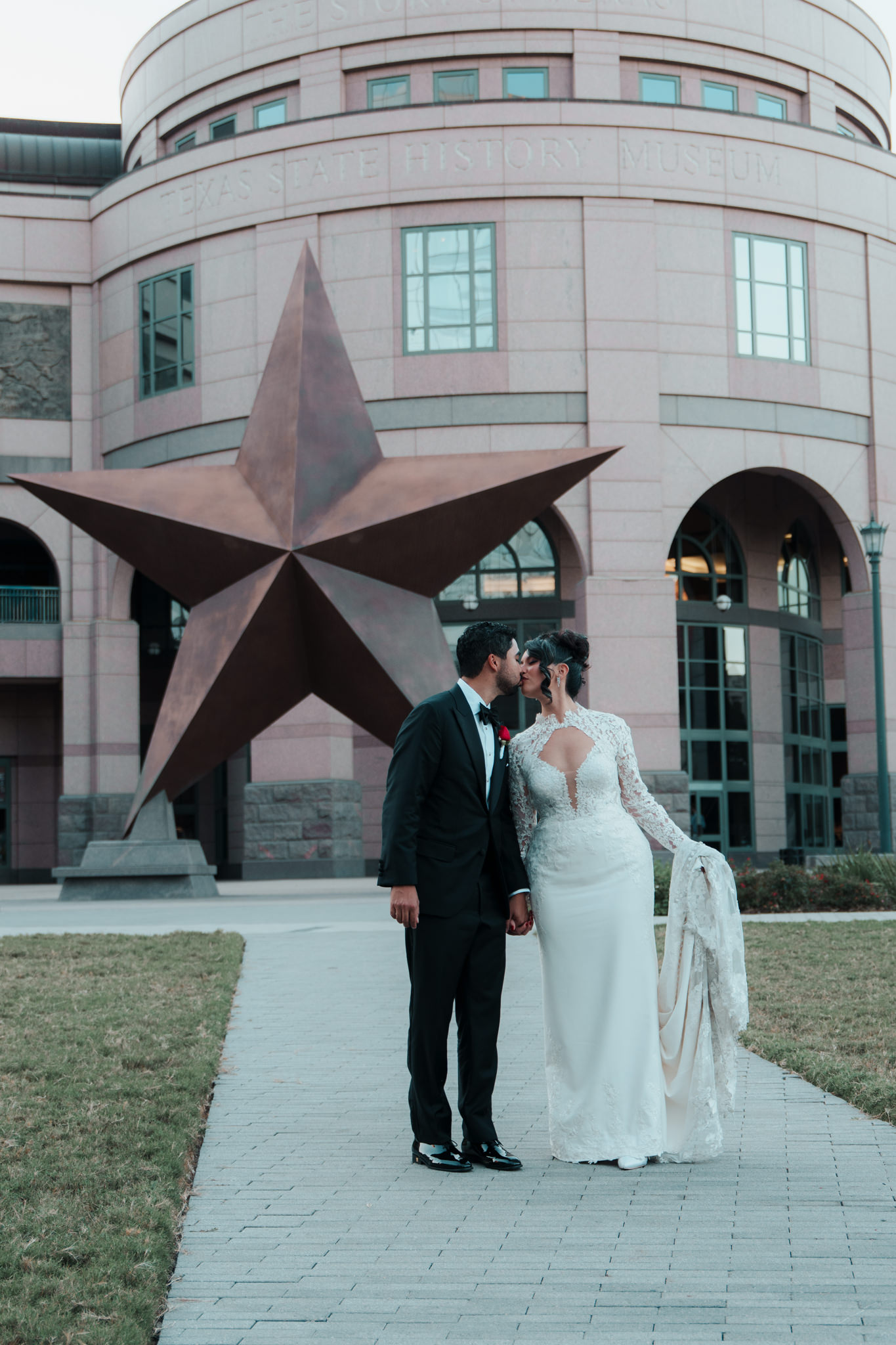Bride and groom sharing an intimate moment in the doorway of Chapel Dulcinea, Austin Texas wedding photography by Moments By Marcela