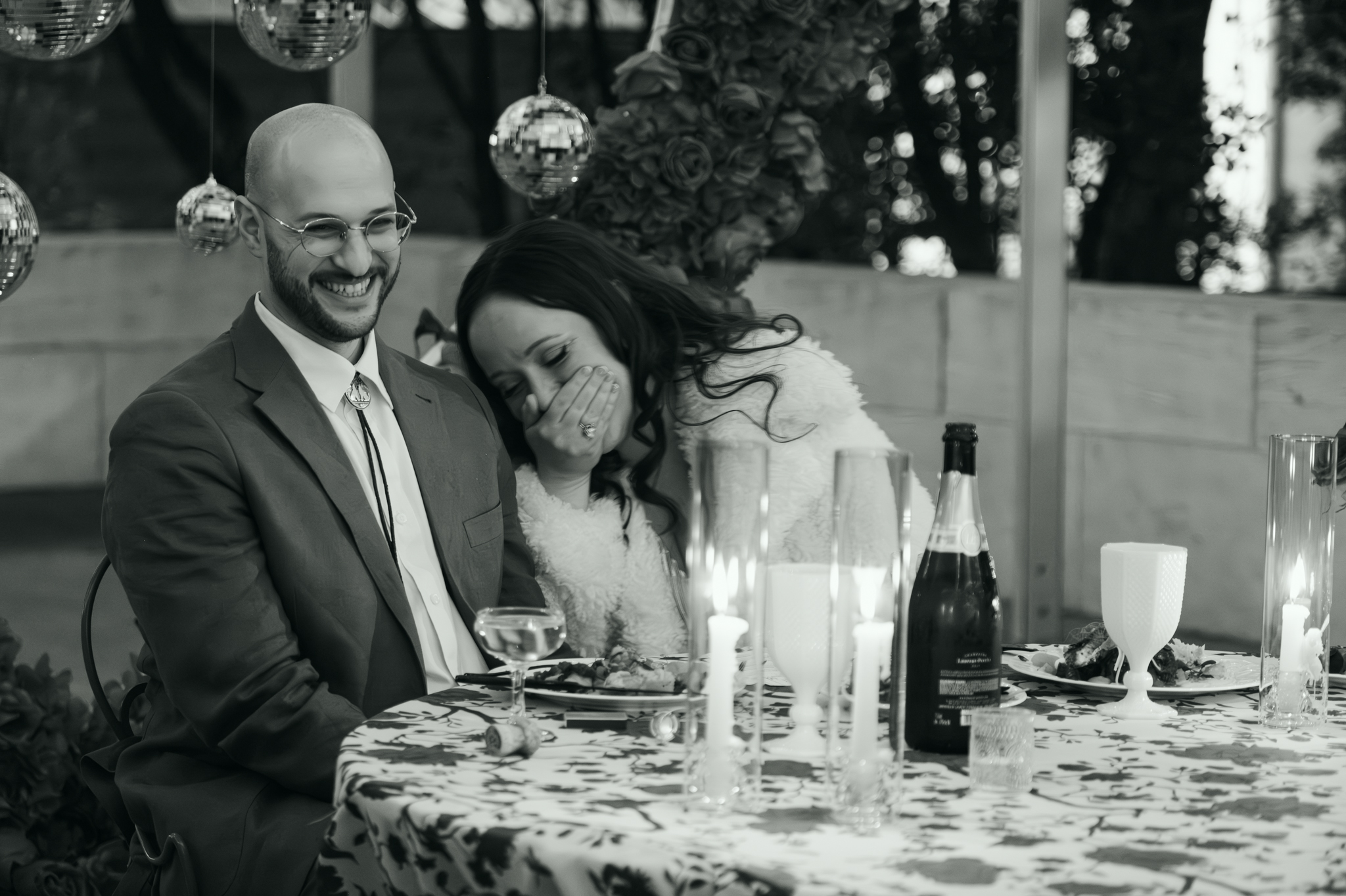Candid documentary wedding photography captures bride and groom laughing together at Austin reception – Moments by Marcela