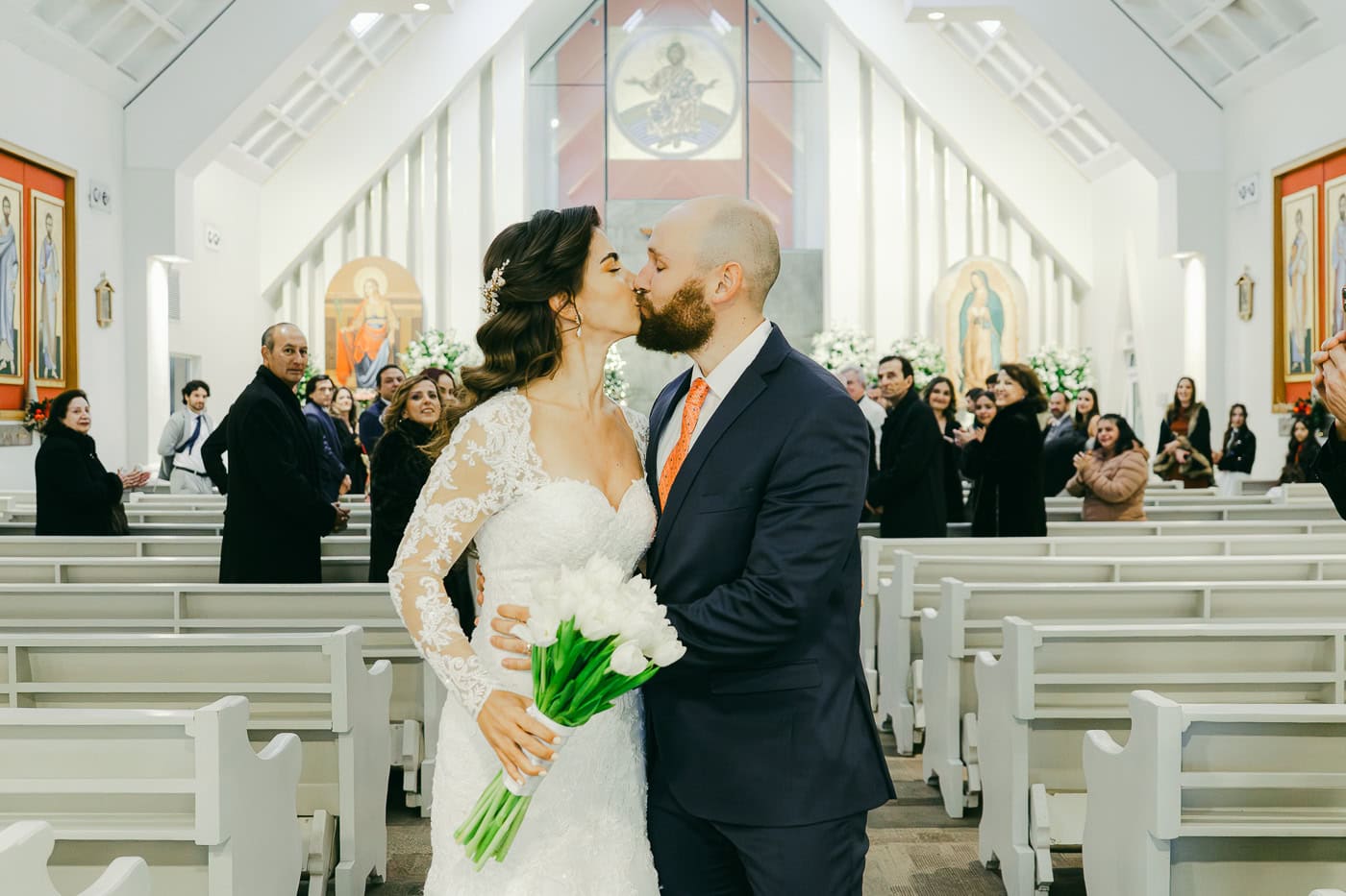 Bride and groom sharing an intimate moment in the doorway of Chapel Dulcinea, Austin Texas wedding photography by Moments By Marcela