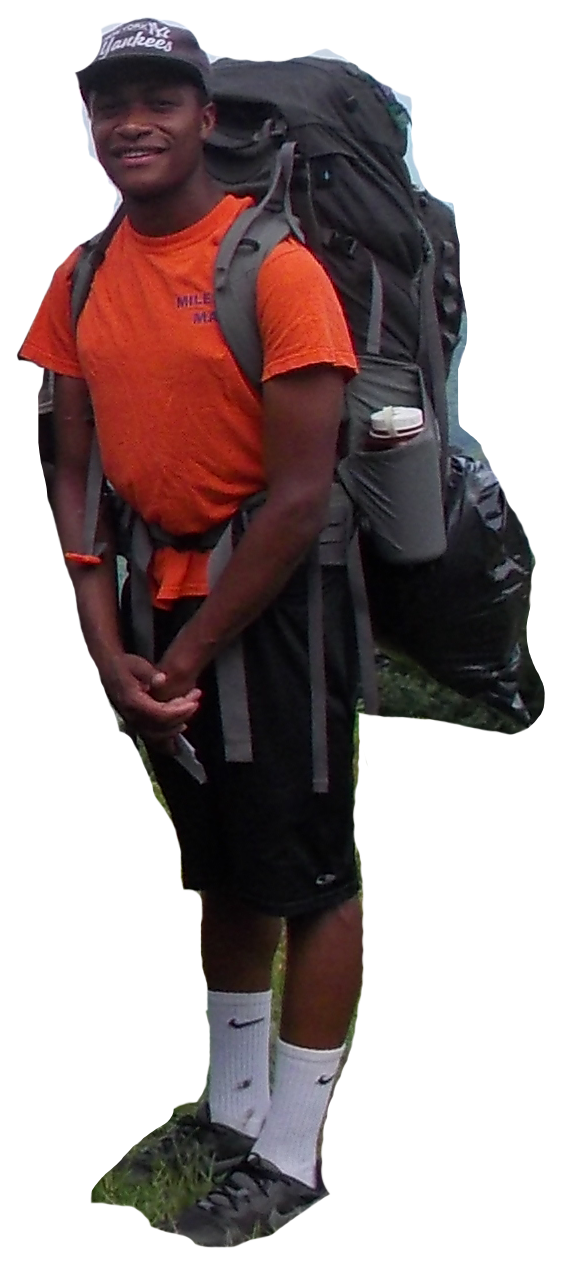 Young man carrying a large hiking backpack at Camp Dogwood