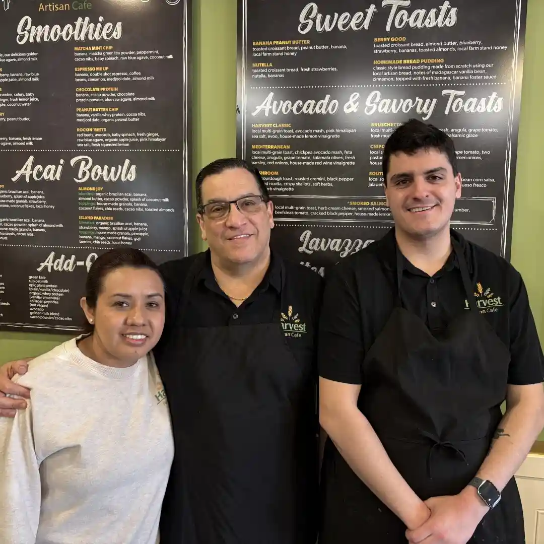 Owners of Harvest Artisan Cafe standing inside the cafe in Huntersville