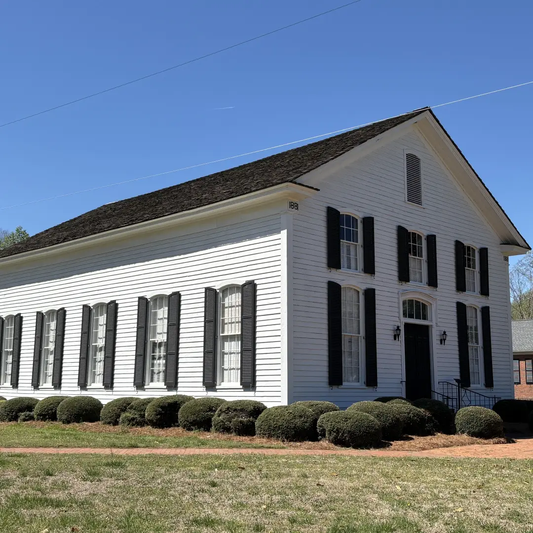 A historic church building in Huntersville representing local worship experiences
