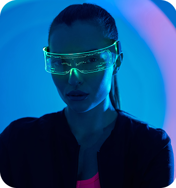 Woman wearing futuristic glowing green visor against a blue background.