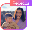 Smiling woman holding a baby wearing a beige sweater against a white background