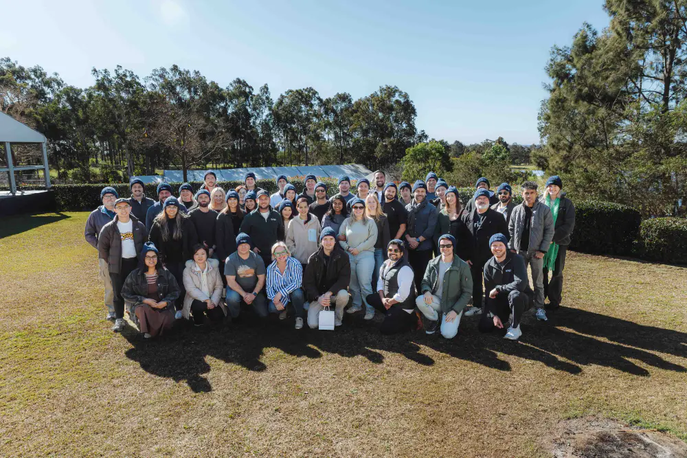 The Bridgit team in matching beanies for a group photo at the team offsite