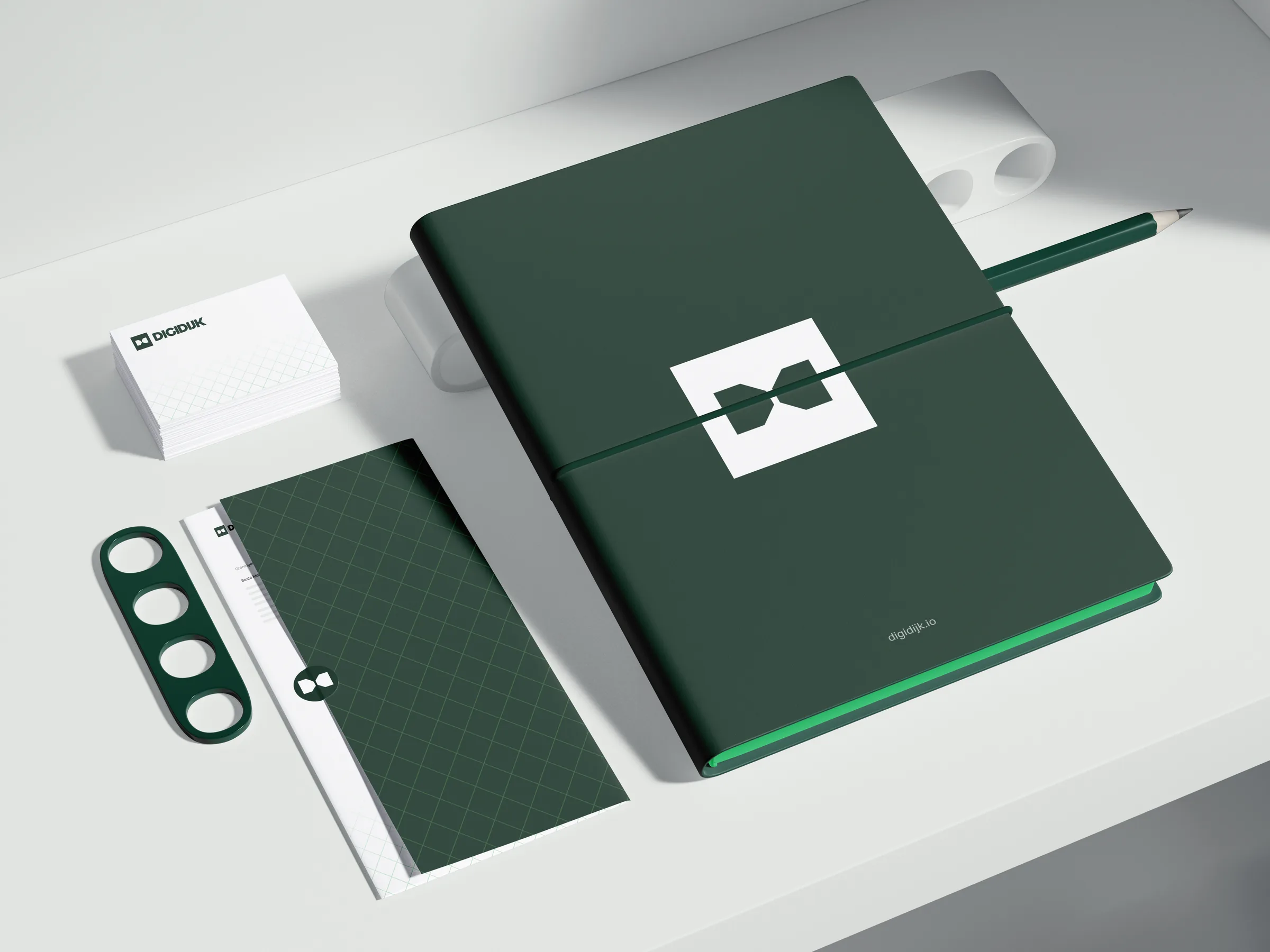 Notitieboek en envelop in de huisstijl van DIGIDIJK
