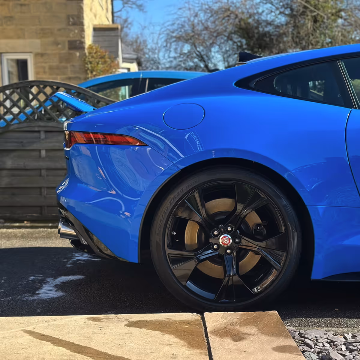 Blue car showing black wheels