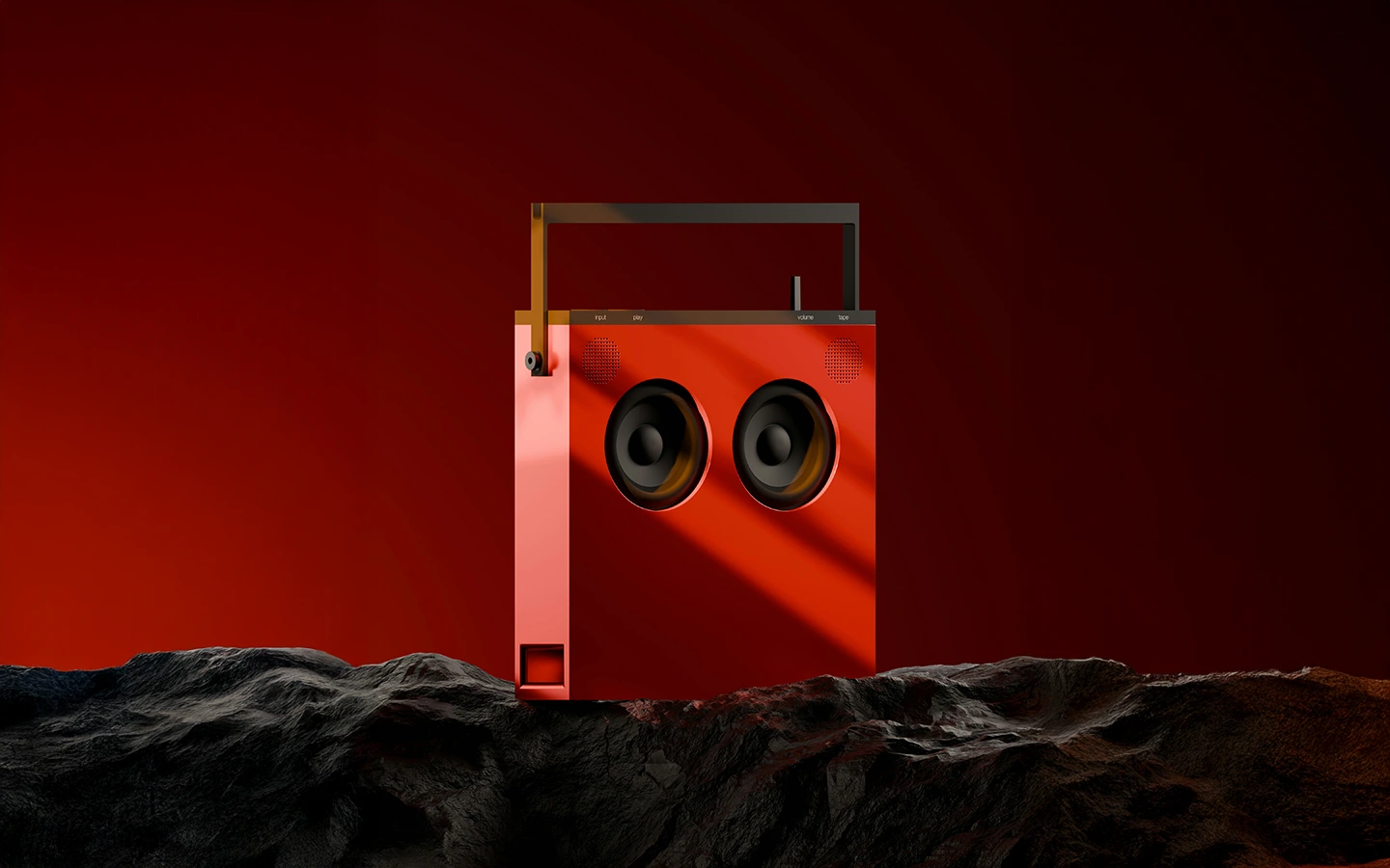 Red portable speaker with two large black circular speakers, placed on a rocky dark surface against a deep red background.