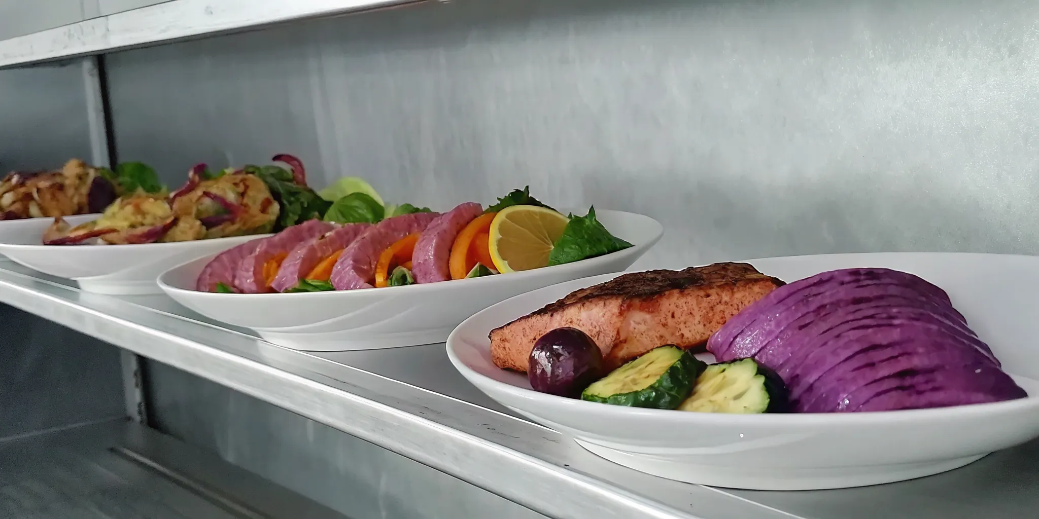 Prepared meals of salmon and vegetables from a meal delivery service review.