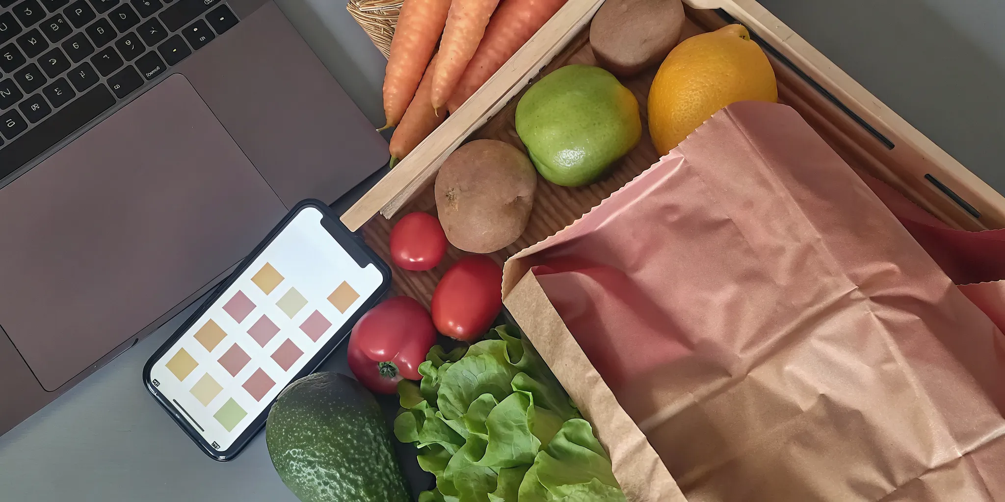 How to start a vegan grocery subscription with a box of fresh produce and a laptop.