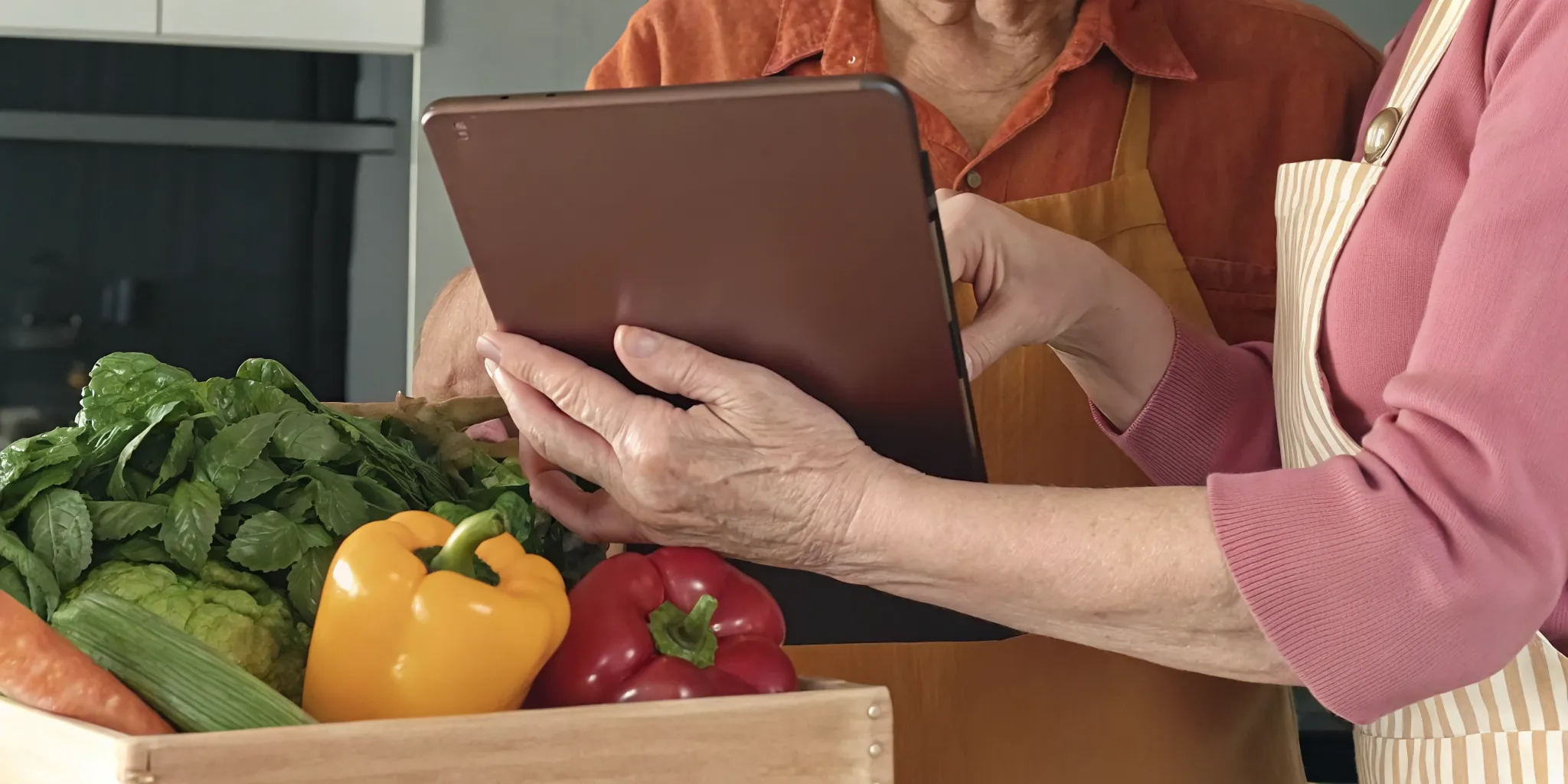 Senior using a tablet to order fresh Ontario groceries for delivery in a bright kitchen setting