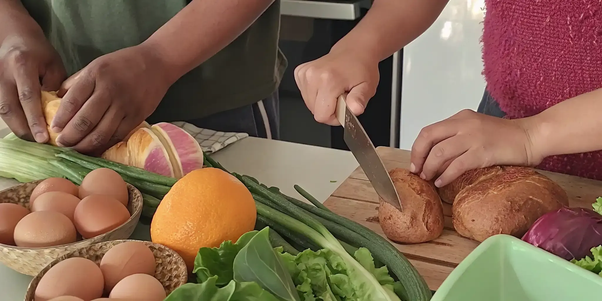 Family preparing a simple meal with fresh groceries for weekly meal planning