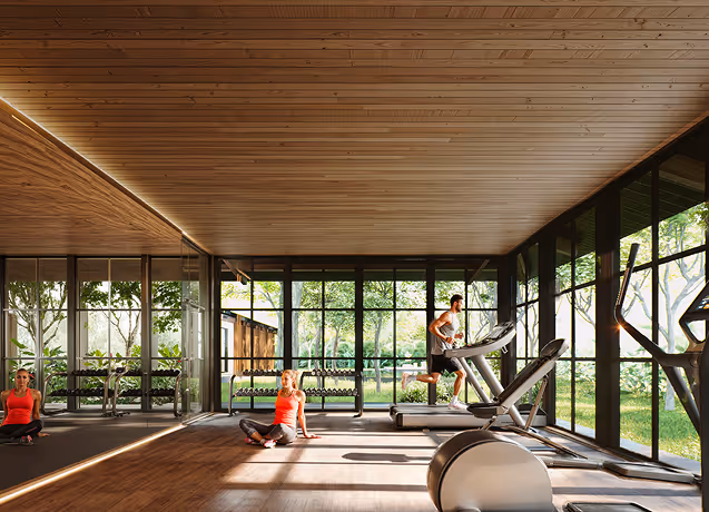 Luminoso gimnasio con vistas a la naturaleza y equipos modernos en Hacienda La Danesa.