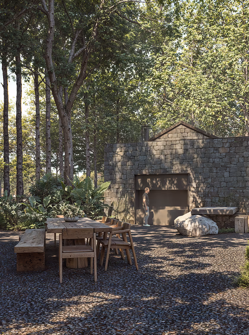 Rustic outdoor dining area at Hacienda La Danesa surrounded by a lush green forest.