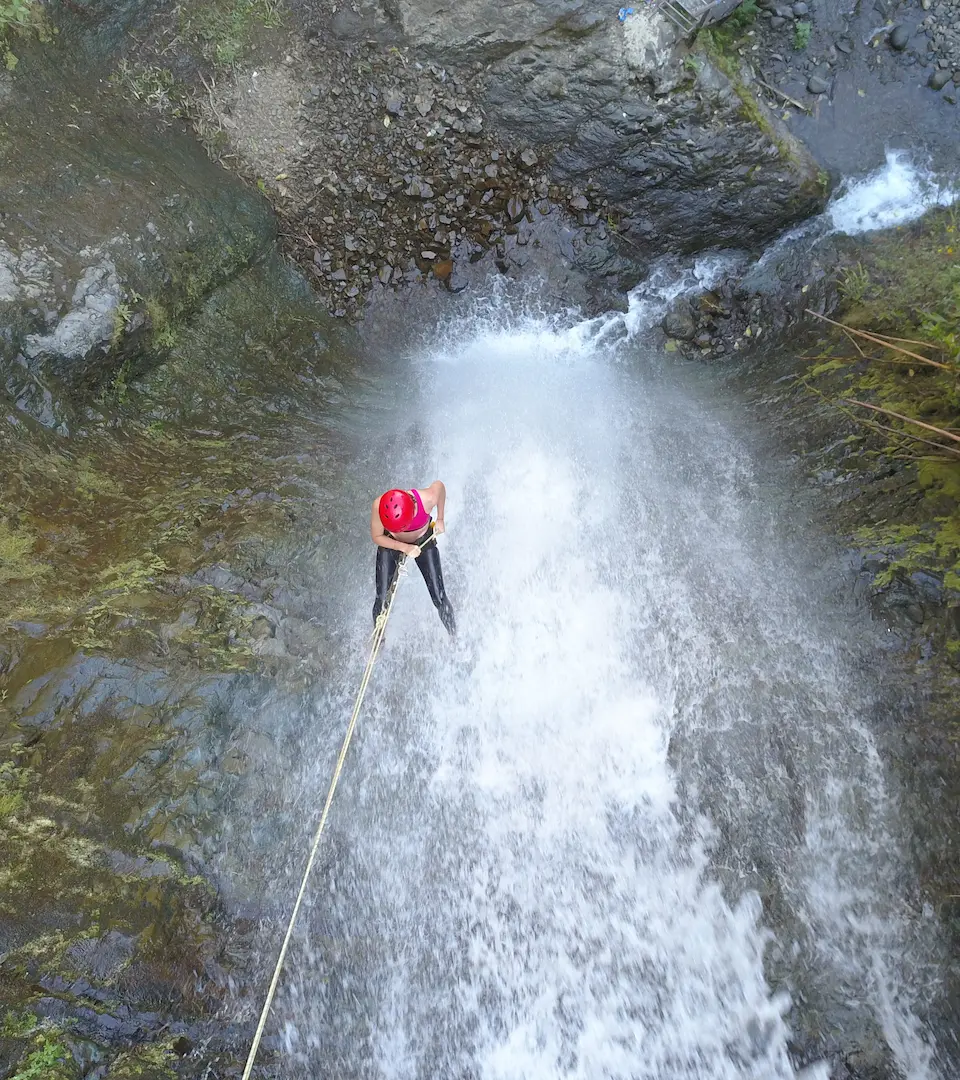 Rappelling down a natural waterfall at Hacienda La Danesa.