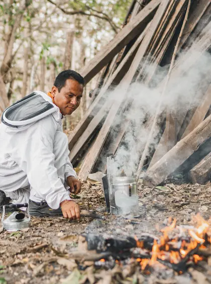 Preparing the bee smoker for beekeeping at Hacienda La Danesa.