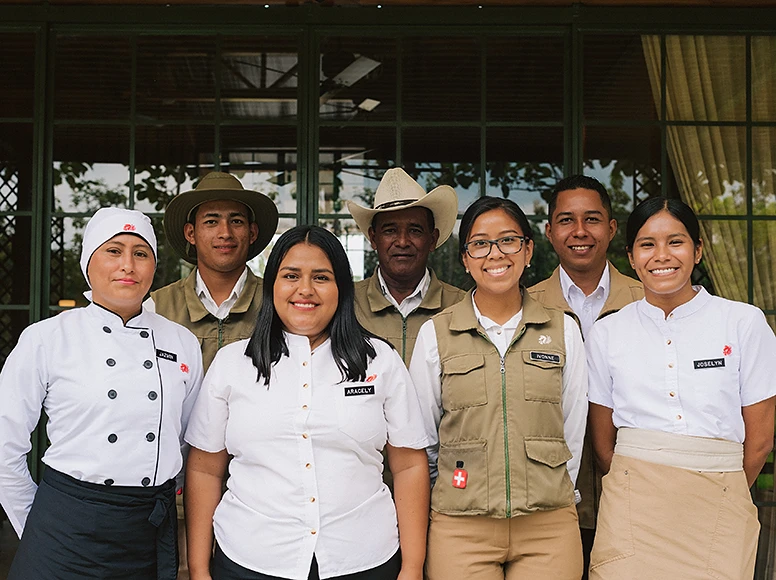 Smiling hospitality team of Hacienda La Danesa, including chefs, guides and service staff