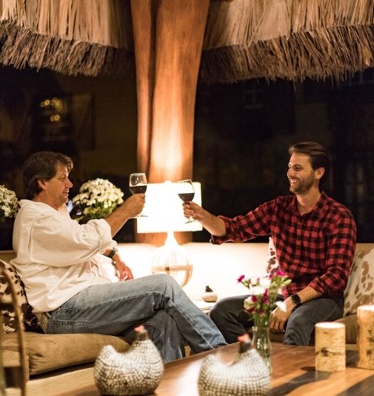 Two guests sharing a toast during a Father's Day celebration at Hacienda La Danesa.