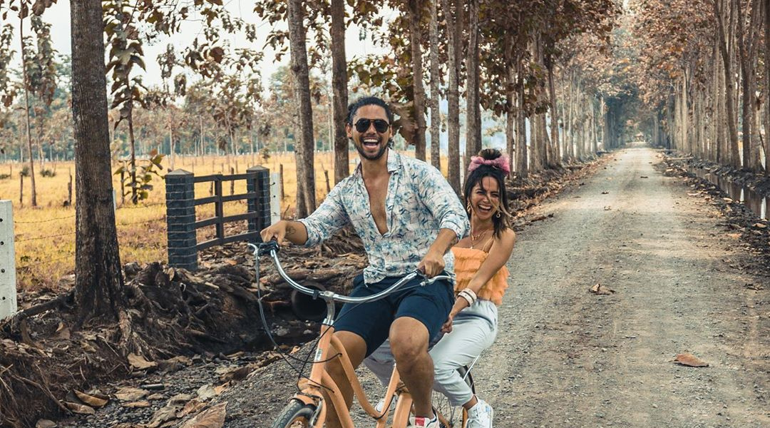 Couple enjoying a bike ride through Hacienda La Danesa