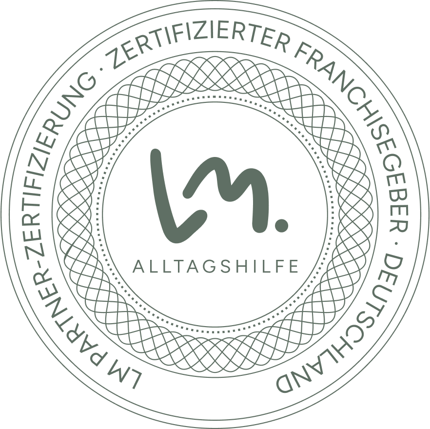 Siegelsymbol mit Text 'LM Alltagshilfe' und Umschrift 'Zertifizierter Franchisegeber Deutschland'