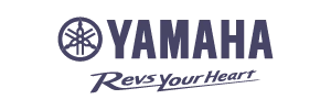 Yamaha Motors logo with stylized tuning fork emblem and 'Revs Your Heart' slogan.