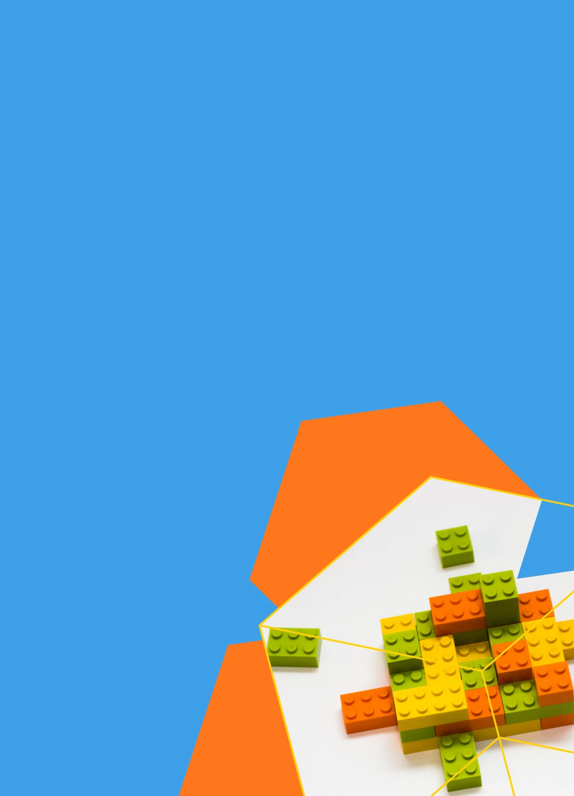 Orange, yellow, and green building blocks arranged on a white surface with a blue and orange geometric background.