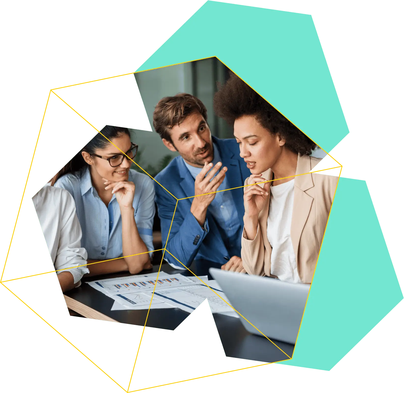 Three colleagues engaged in a discussion over documents and a laptop in a modern office setting.