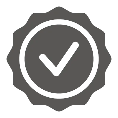 Round badge with scalloped edges featuring a check mark inside a circle, symbolizing approval.