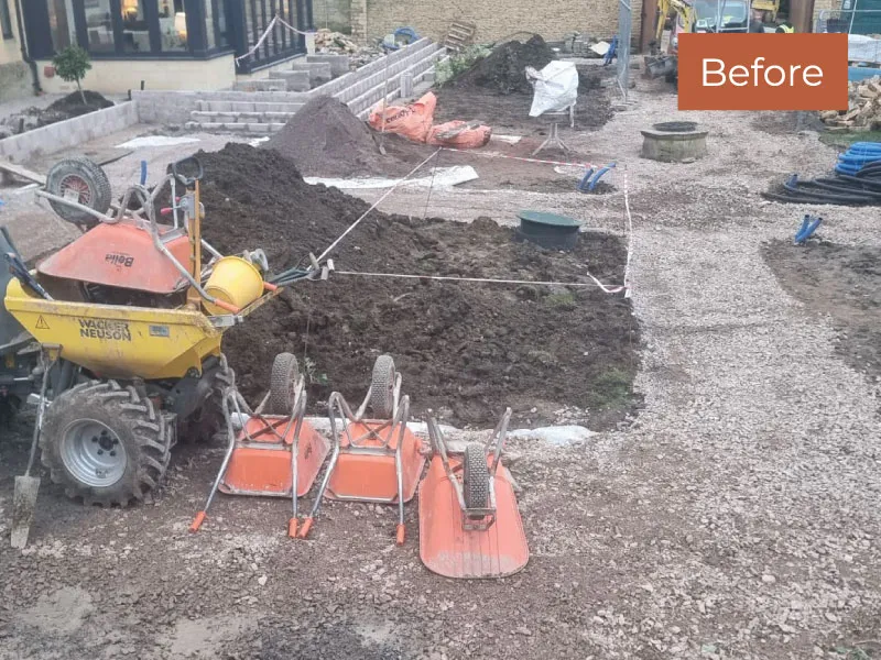 Construction site with wheelbarrows and soil piles preparing ground for garden landscaping.