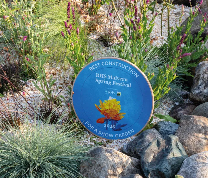 Blue award plaque in garden reading Best Construction for a Show Garden, RHS Malvern Spring Festival 2026.