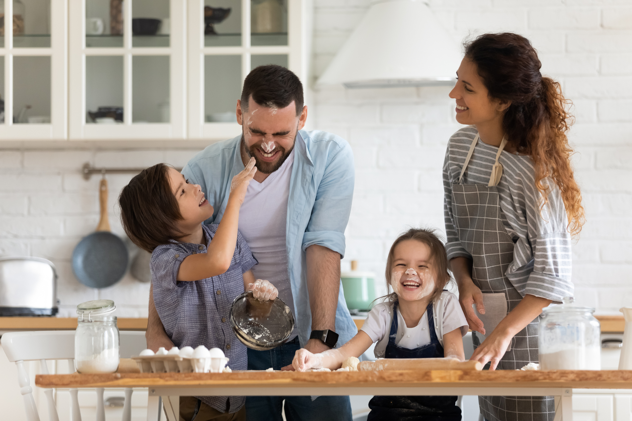 family memories being made cooking in the kitchen