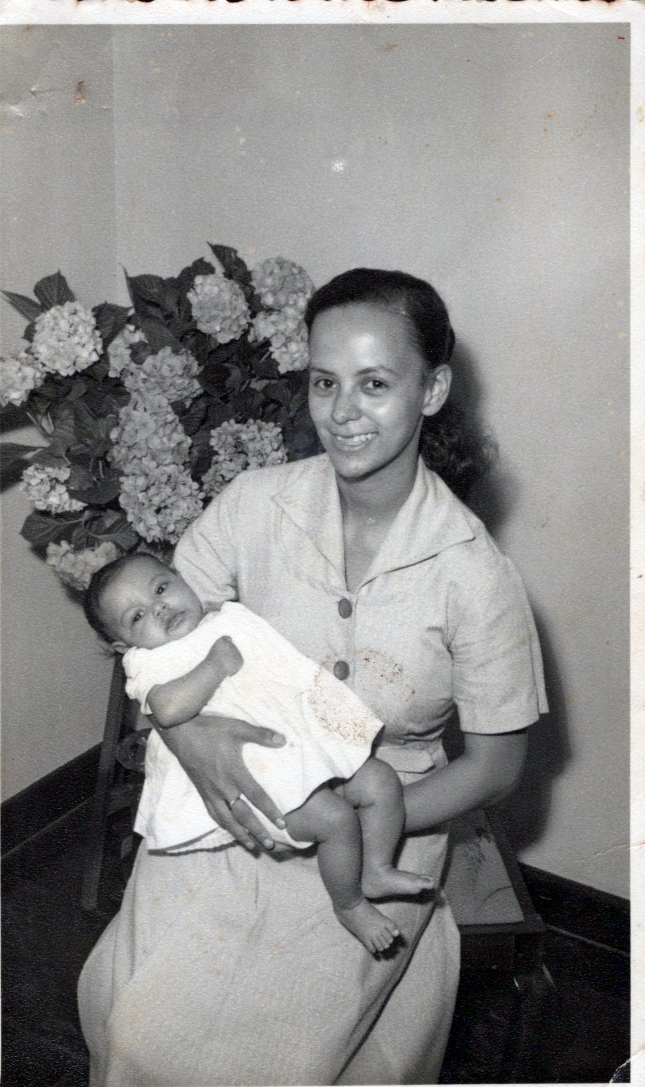 Old preserved memory photo of grandmother with baby 