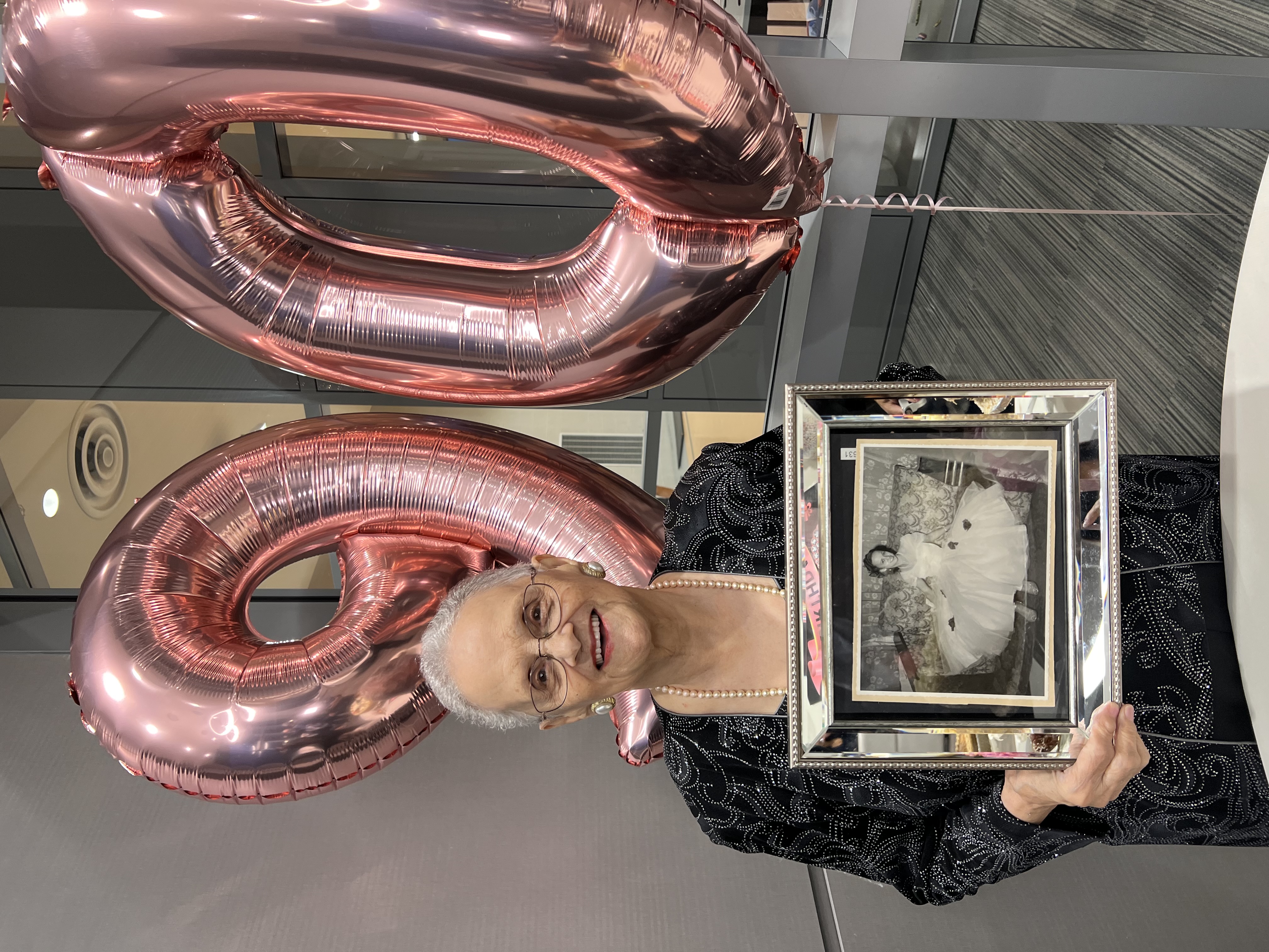 Grandmother 90th birthday holding photo , preseving memories 