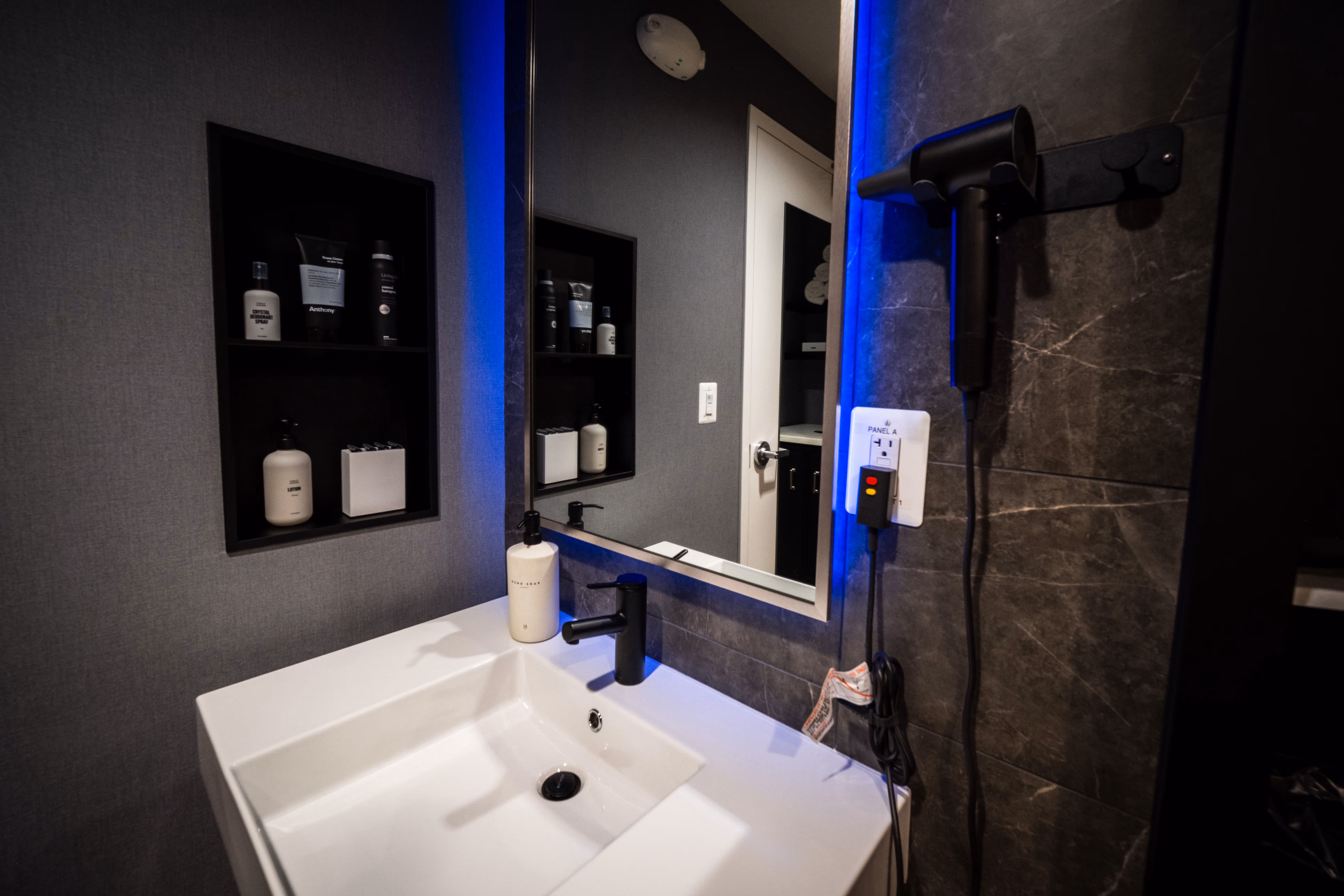 Vanity inside a private shower suite at the TRAIN Training House™ in Vienna