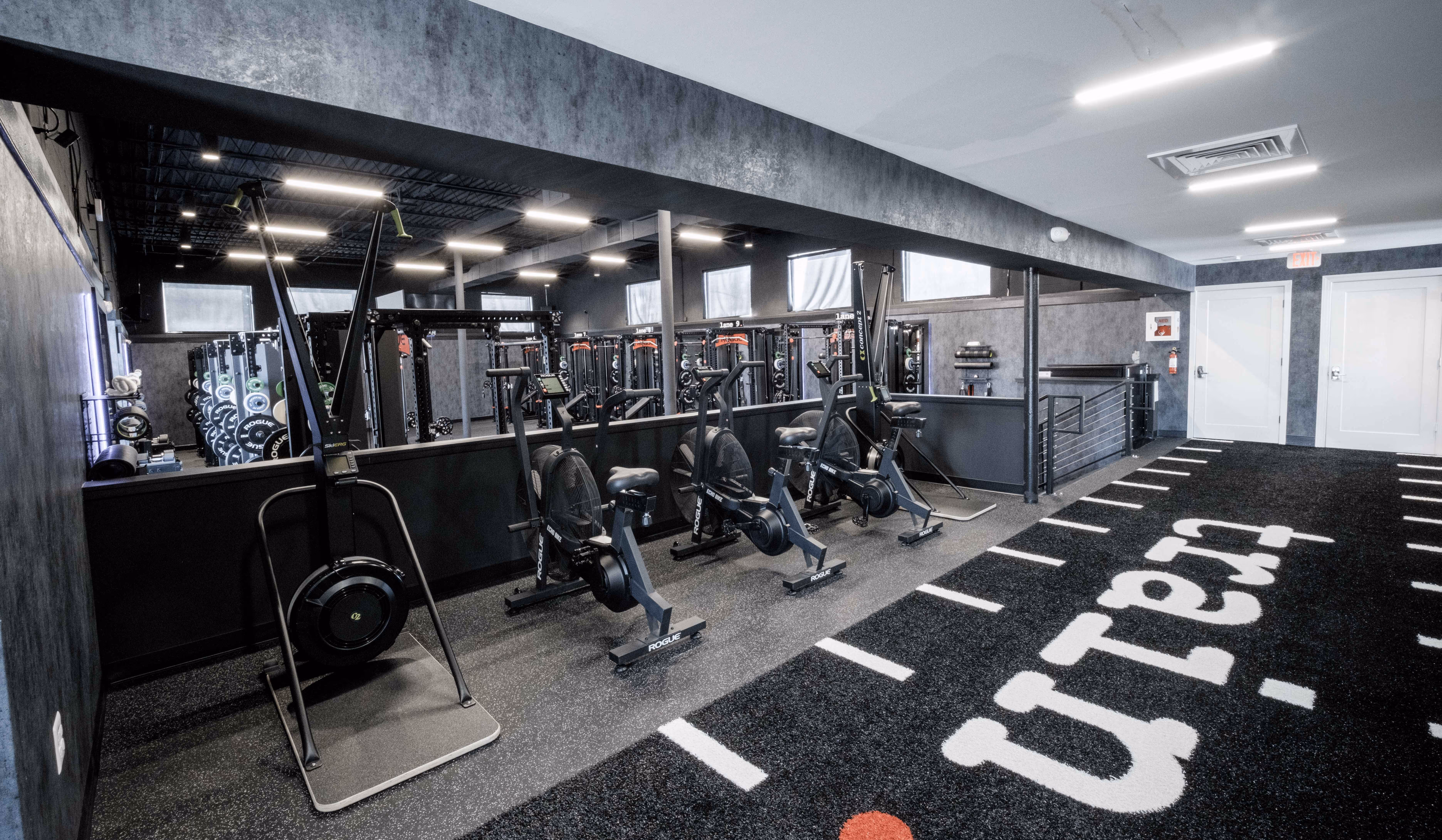 Cardio Deck and turf run inside a TRAIN Training House™, supporting one-on-one personal training alongside private SpecLanes™