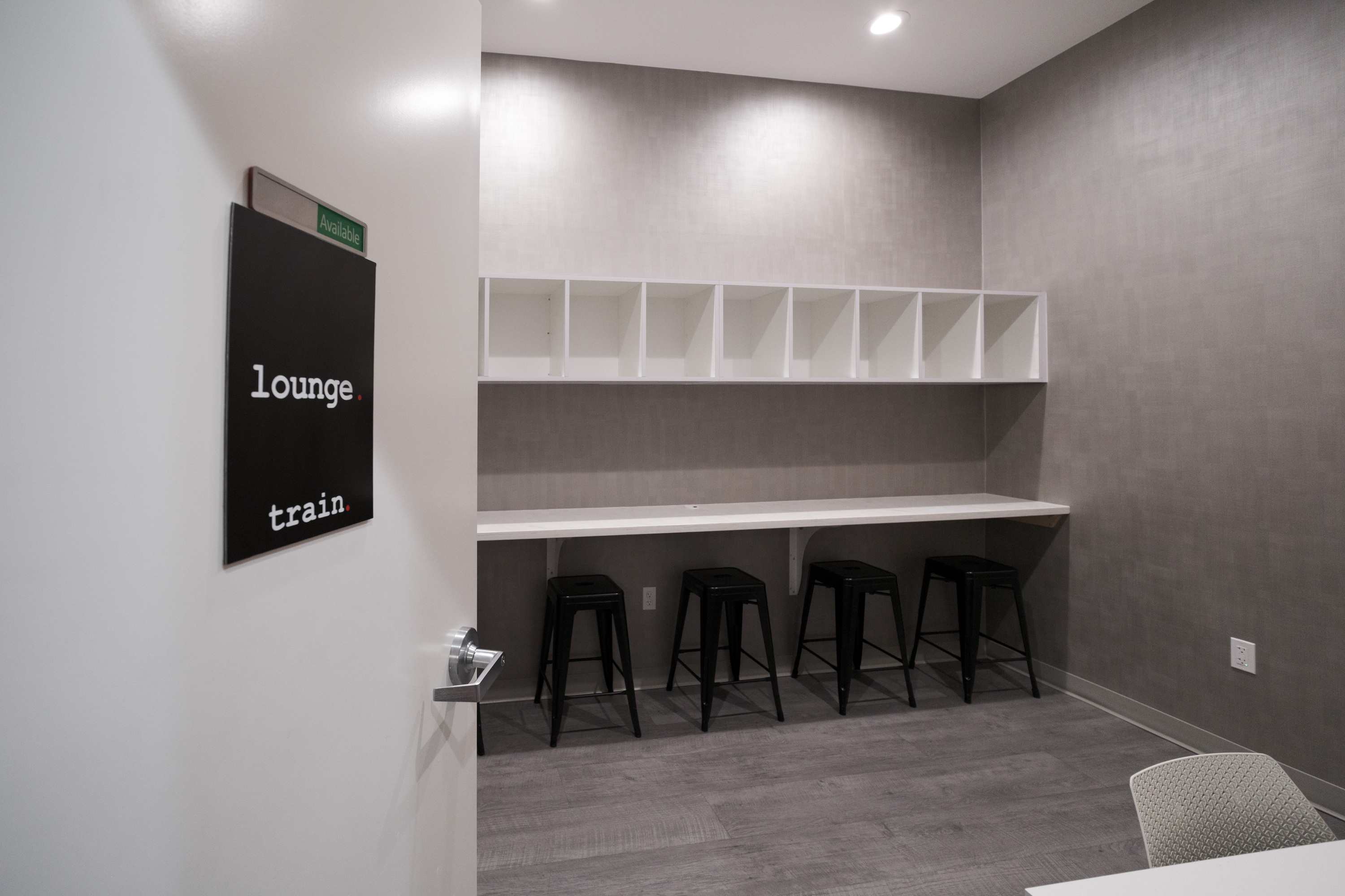 Private lounge area inside a TRAIN Training House™ in McLean designed for quiet preparation and client consultation
