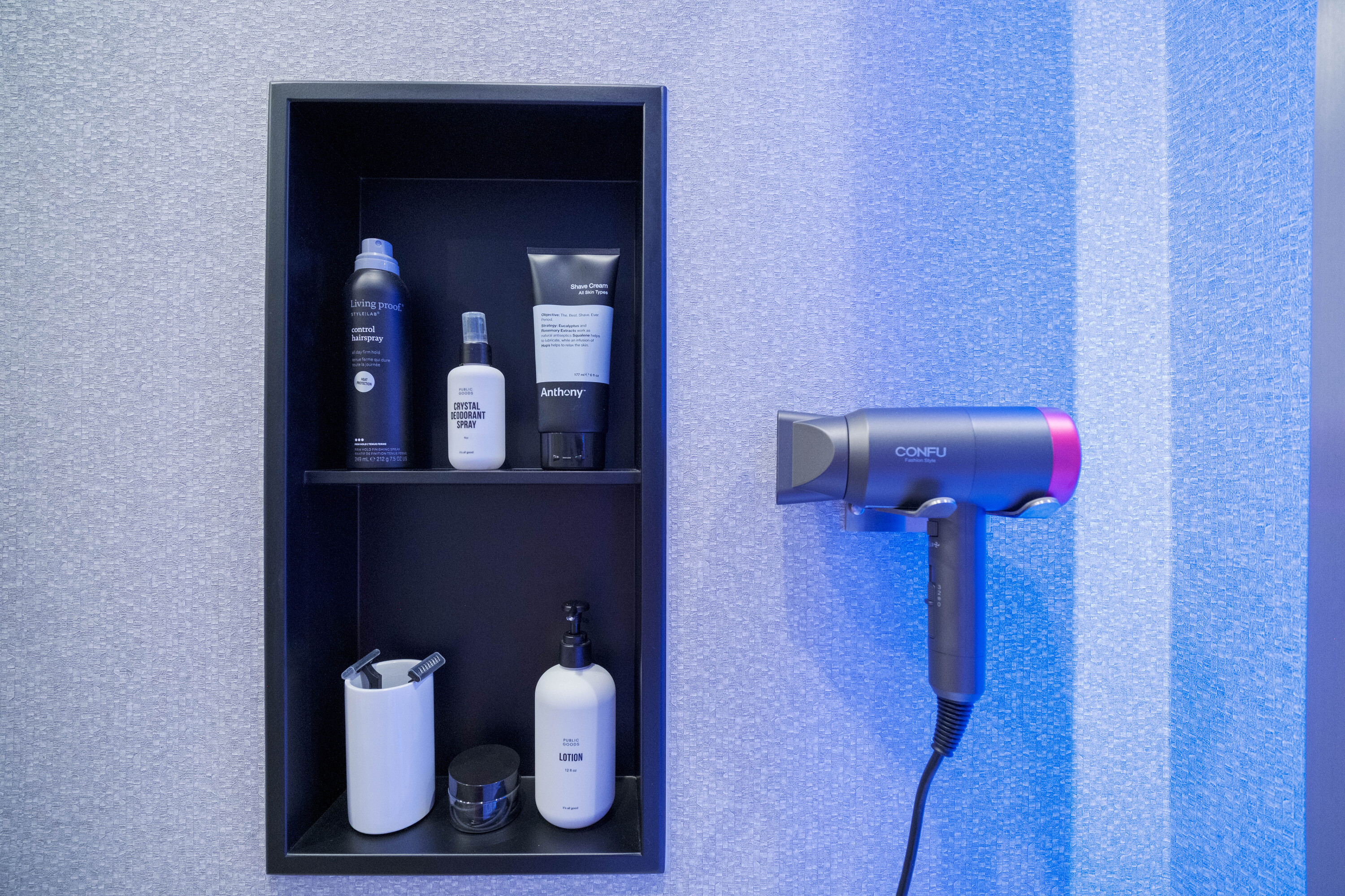 Private grooming amenities inside a TRAIN Training House™ in McLean featuring organized, high-quality products in a clean, minimal setting