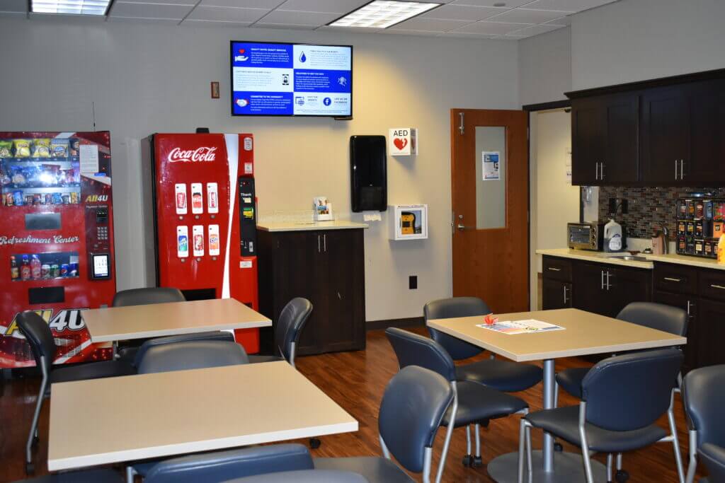 digital signage hung up in employee break room
